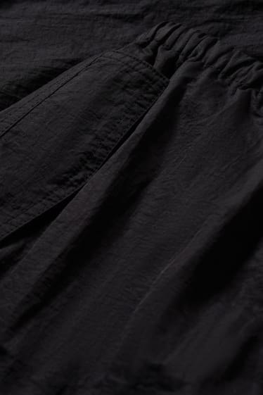 Dames - CLOCKHOUSE - parachutebroek - mid waist - straight fit - zwart