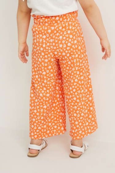 Dzieci - Spodnie z tkaniny - w kwiaty - pomarańczowy