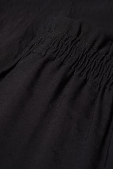 Femmes - Pantalon de toile - mid waist - coupe fuselée - noir