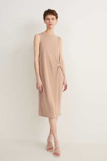 Dames - Kokerjurk met knoop in de stof - beige