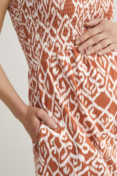 Dames - Korte zwangerschapsjumpsuit - met patroon - bruin