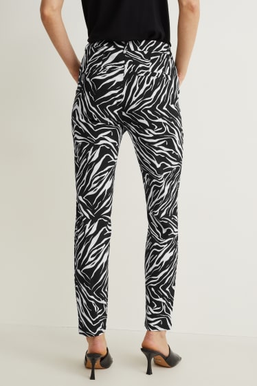 Dames - Broek - mid waist - slim fit - Flex - met patroon - zwart / wit