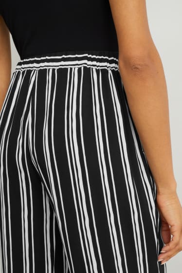 Femmes - Pantalon de toile - mid waist - palazzo - à rayures - noir / blanc