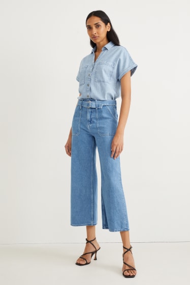 Femmes - Jean à jambe évasée avec ceinture - high waist - jean bleu clair