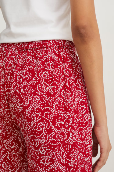 Dona - Pantalons de tela - mid waist - wide leg - estampats - vermell