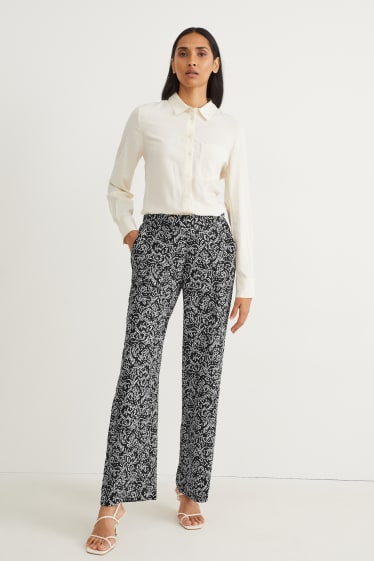 Mujer - Pantalón de tela - mid waist - wide leg - estampado - negro / blanco