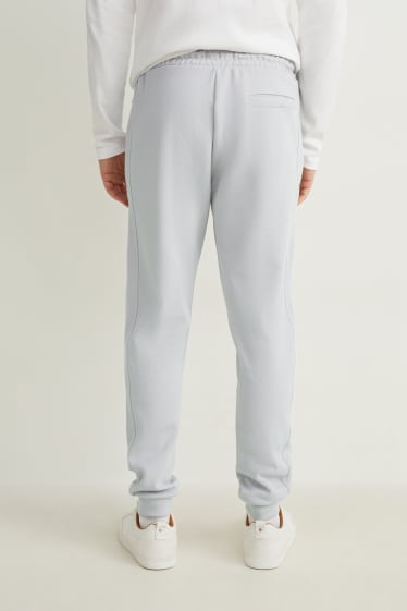 Uomo - Pantaloni sportivi - grigio chiaro