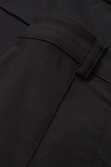 Nastolatki - CLOCKHOUSE - spodnie materiałowe - średni stan - bootcut fit - czarny