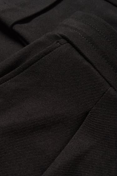 Dona - Pantalons de tela - mid waist - tapered fit - negre