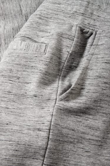Mężczyźni - Spodnie dresowe - jasnoszary-melanż