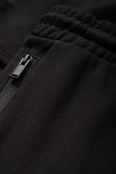 Uomo - Pantaloni sportivi - nero