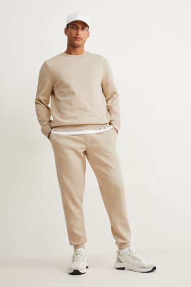 Uomo - Pantaloni sportivi - beige