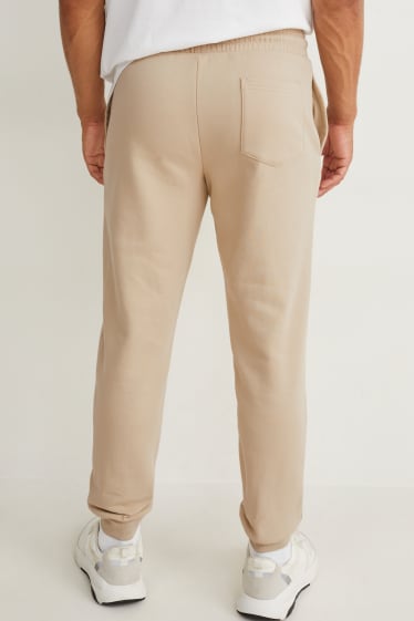 Uomo - Pantaloni sportivi - beige