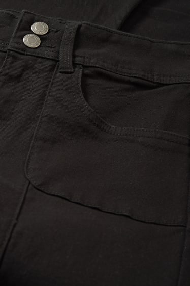 Nastolatki - CLOCKHOUSE - spodnie - niski stan - bootcut fit - czarny