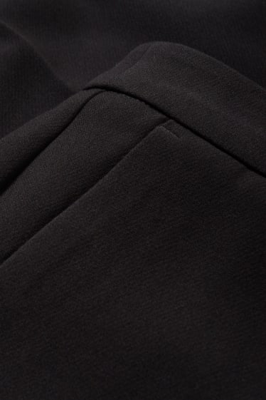 Dona - Pantalons de tela - high waist - flared - negre