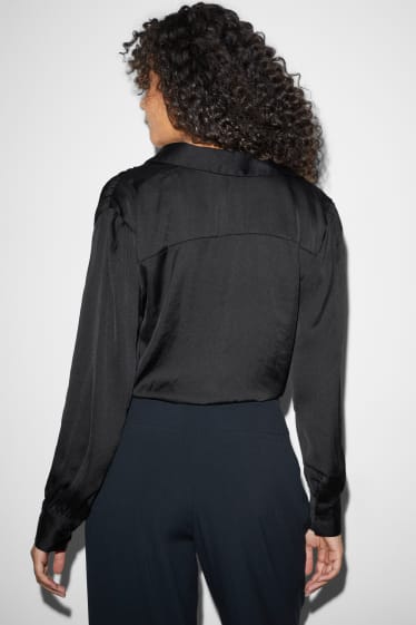 Jóvenes - CLOCKHOUSE - blusa satinada con nudo - negro