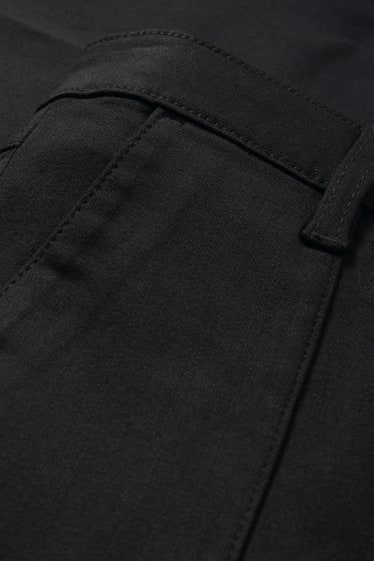 Dona - Pantalons de tela - high waist - flared - negre