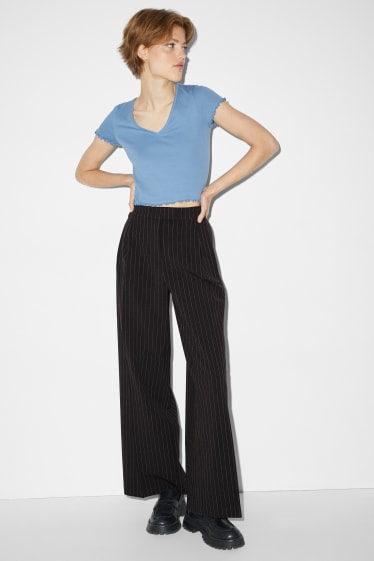 Jóvenes - CLOCKHOUSE - pantalón de tela - mid waist - wide leg - negro