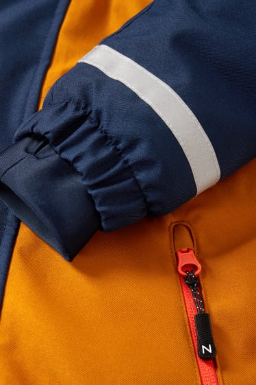 Kinderen: jongens - Skipak met capuchon - oranje / blauw