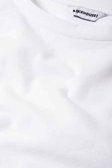 Ragazzi e giovani - CLOCKHOUSE - maglia a maniche lunghe dal taglio corto - bianco