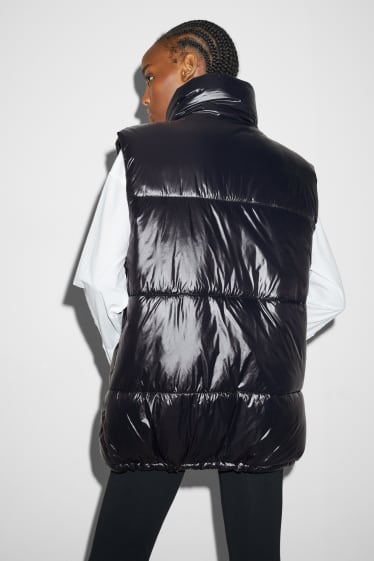 Women - Long quilted gilet - black