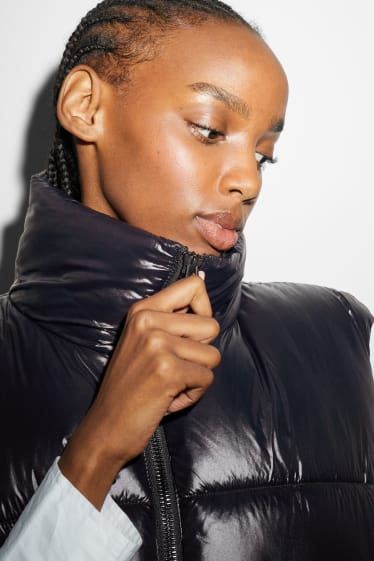 Women - Long quilted gilet - black