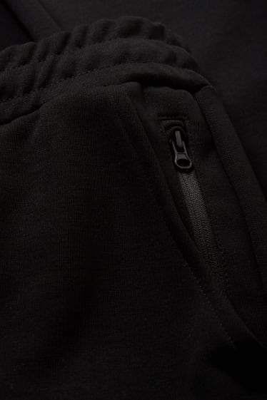 Pánské - Funkční teplákové kalhoty - černá