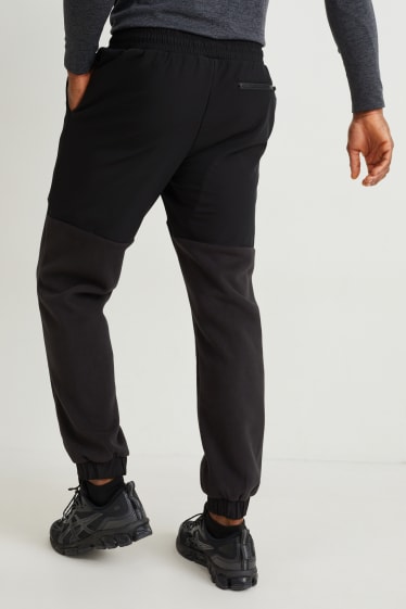 Pánské - Teplákové kalhoty - černá
