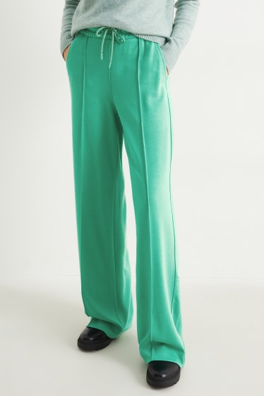 Dámské - Žerzejové kalhoty - wide leg - zelená