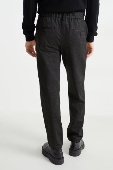 Uomo - Pantaloni - tapered fit - Flex - nero