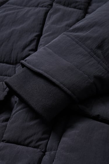Home - Jaqueta embuatada amb caputxa - blau fosc