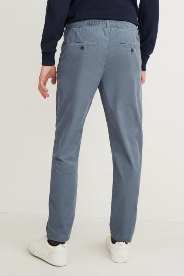 Uomo - Pantaloni chino in velluto - tapered fit - azzurro