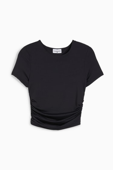Joves - CLOCKHOUSE - samarreta de màniga curta crop - negre