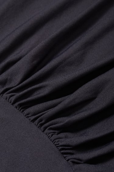 Joves - CLOCKHOUSE - samarreta de màniga curta crop - negre