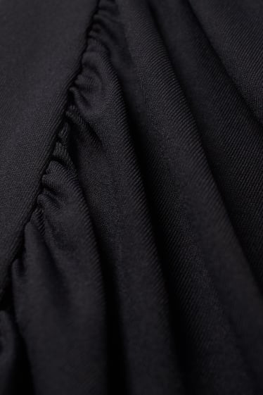 Adolescenți și tineri - CLOCKHOUSE - rochie cu un umăr gol - negru