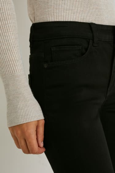 Kobiety - Skinny jeans - średni stan - dżinsy modelujące - LYCRA® - czarny