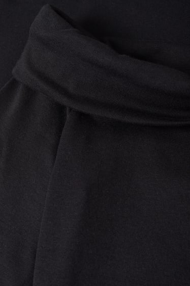 Nastolatki - CLOCKHOUSE - krótka bluzka z długim rękawem - czarny