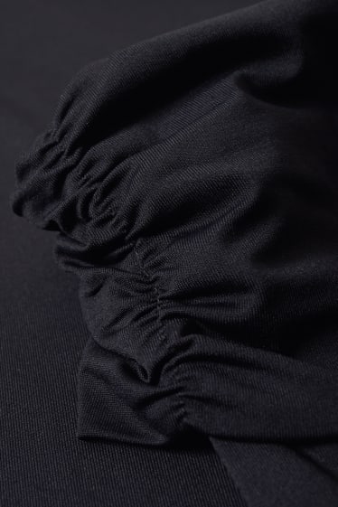 Femmes - CLOCKHOUSE - robe dénudée sur une épaule - noir