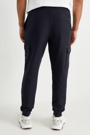 Home - Pantalons de xandall cargo - blau fosc