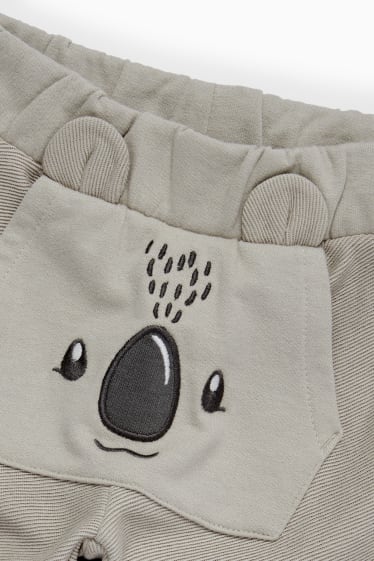 Nadó nen - Coala - pantalons de xandall per a nadó - gris