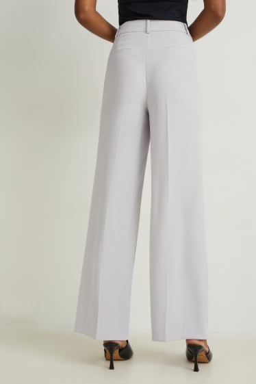 Kobiety - Spodnie biznesowe - wysoki stan - szerokie nogawki - jasnoszary