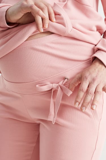 Kobiety - Ciążowe spodnie dresowe - jasnoróżowy
