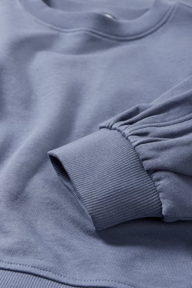 Nastolatki - CLOCKHOUSE - krótka bluza - niebieski