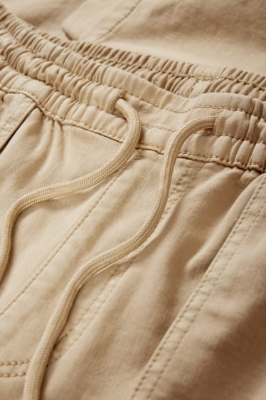Hommes - Pantalon cargo - jambes fuselées - beige