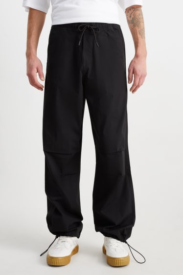 Men - Parachute trousers - black