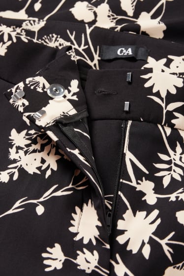 Kobiety - Spodnie materiałowe - średni stan - bootcut fit - w kwiaty - czarny