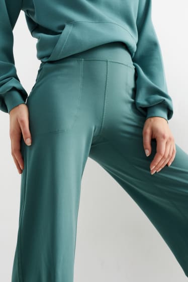 Kobiety - Sportowe legginsy - efekt modelujący - 4 Way Stretch - zielony