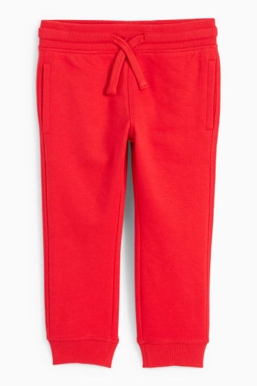 Dětské - Teplákové kalhoty - červená