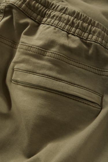 Mężczyźni - Spodnie bojówki - tapered fit - LYCRA® - kaki