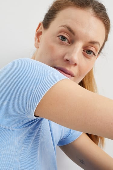 Dona - Samarreta de màniga curta tècnica - sense costures - protecció UV - blau clar